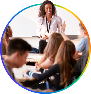 An enthusiastic teacher, ready to answer the question of a student who is raising their hand.