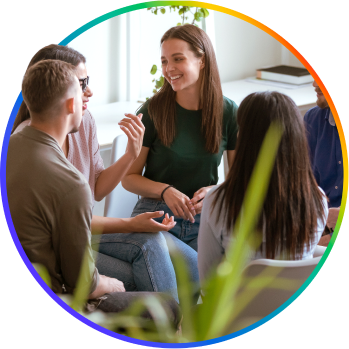 A group of young teachers in the middle of a discussion.